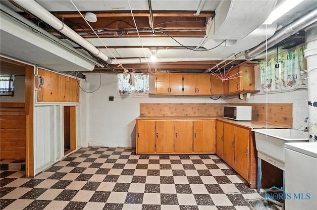 2632 117th St, Toledo, OH 43611 - unfinished basement featuring dark floors and a sink