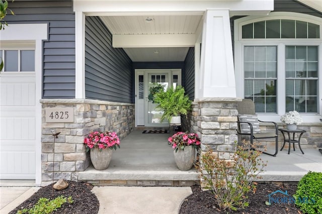 4825 Sylvan Prairie Ct, Sylvania, OH 43560 - entrance to property featuring a porch and stone siding