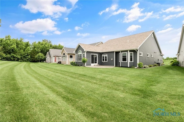 4825 Sylvan Prairie Ct, Sylvania, OH 43560 - back of house featuring a patio, a yard, and roof with shingles