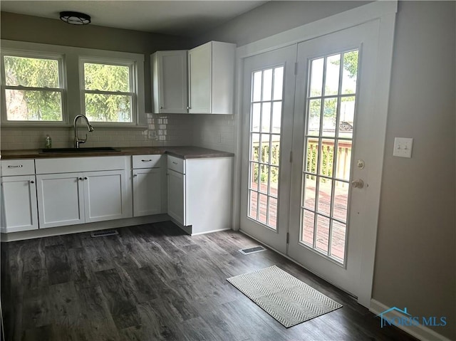 101 S Madison St, Antwerp, OH 45813 - kitchen with tasteful backsplash, dark wood-style floors, and white cabinetry