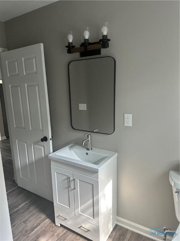 101 S Madison St, Antwerp, OH 45813 - bathroom with wood finished floors and vanity