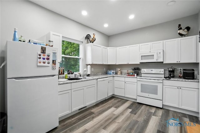 407 Washington St, Findlay, OH 45840 - kitchen with white appliances, white cabinets, wood finished floors, and recessed lighting