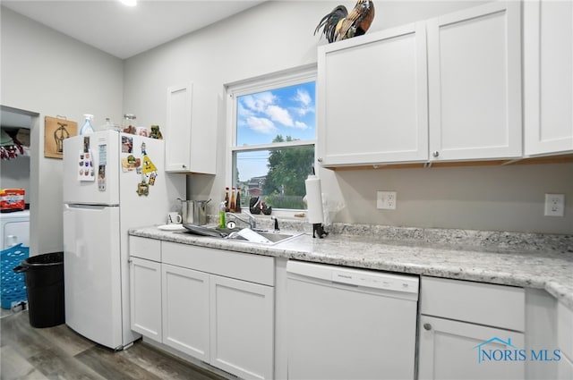 407 Washington St, Findlay, OH 45840 - kitchen with white appliances, wood finished floors, white cabinetry, and light countertops