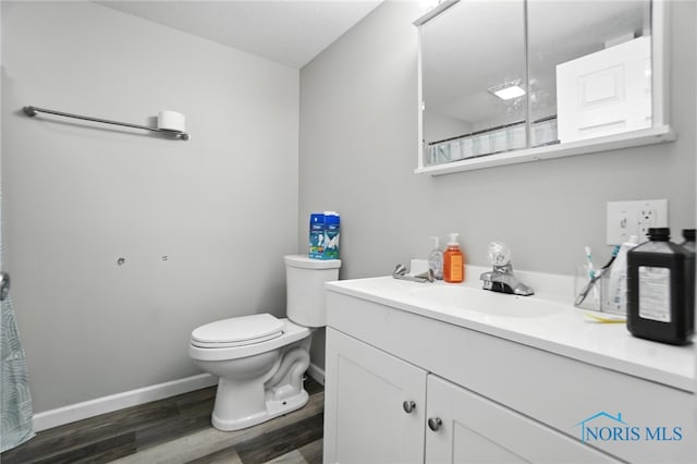 407 Washington St, Findlay, OH 45840 - bathroom with vanity, wood finished floors, and a shower with shower curtain