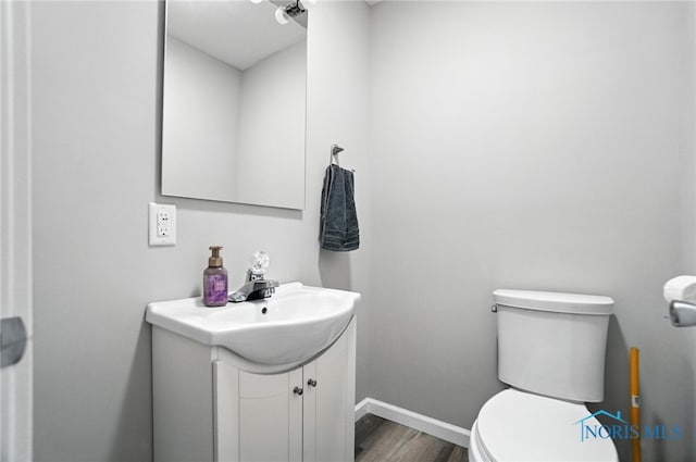 407 Washington St, Findlay, OH 45840 - bathroom featuring vanity and wood finished floors