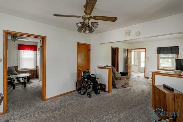 5712 Rambo Ln, Toledo, OH 43623 - carpeted living room with ceiling fan and baseboards