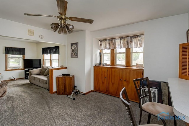 5712 Rambo Ln, Toledo, OH 43623 - carpeted living room with ceiling fan and baseboards