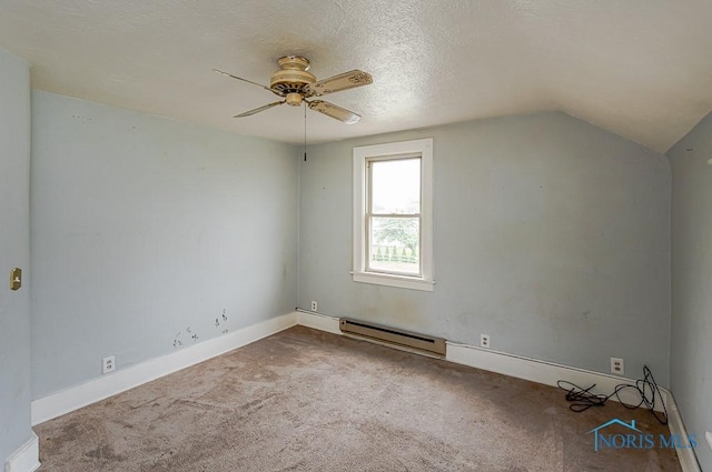 5712 Rambo Ln, Toledo, OH 43623 - additional living space with baseboard heating, a ceiling fan, carpet flooring, vaulted ceiling, and a textured ceiling