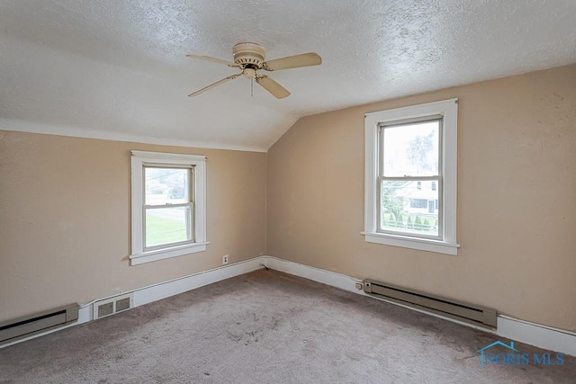 5712 Rambo Ln, Toledo, OH 43623 - bonus room featuring baseboard heating, carpet, ceiling fan, vaulted ceiling, and a textured ceiling