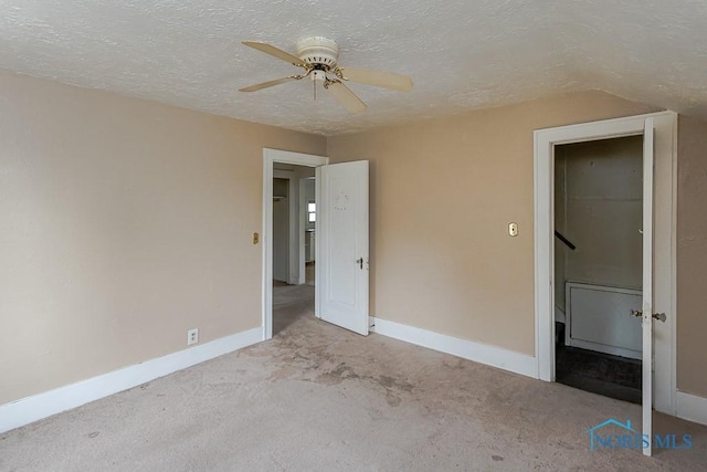 5712 Rambo Ln, Toledo, OH 43623 - unfurnished bedroom with a textured ceiling, carpet, and a ceiling fan