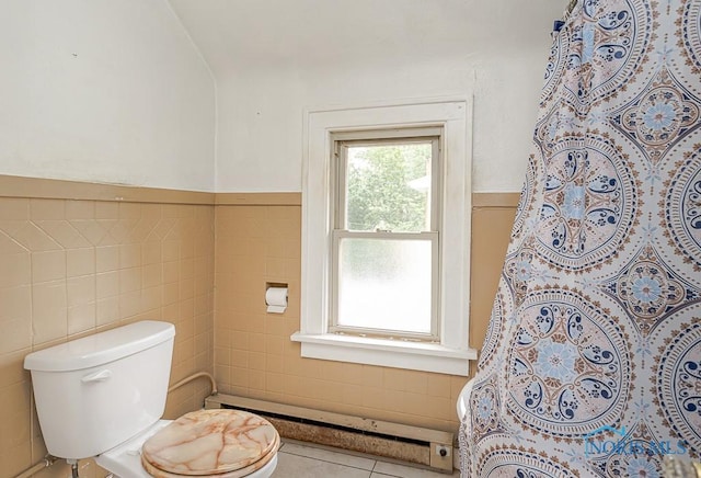 5712 Rambo Ln, Toledo, OH 43623 - bathroom featuring tile walls, a wainscoted wall, a shower with curtain, tile patterned flooring, and a baseboard heating unit