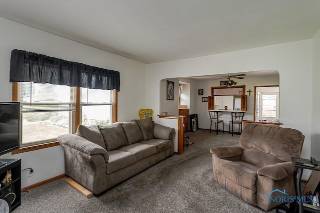 5712 Rambo Ln, Toledo, OH 43623 - living room with carpet, arched walkways, and a ceiling fan