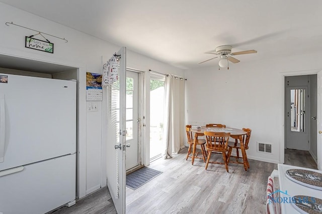 5712 Rambo Ln, Toledo, OH 43623 - dining space featuring light wood-type flooring and a ceiling fan