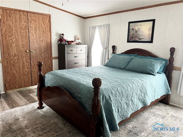 120 E Nicholas St, Arlington, OH 45814 - bedroom with crown molding, wood finished floors, and a textured ceiling