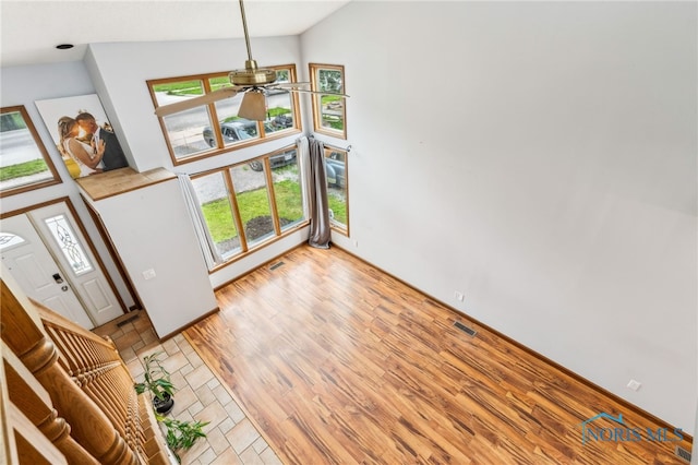 801 W Sandusky St, Findlay, OH 45840 - unfurnished living room with ceiling fan, plenty of natural light, light wood-style floors, and high vaulted ceiling