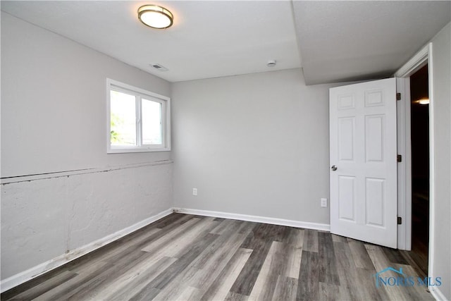 6182 Old Farm Ct, Toledo, OH 43612 - unfurnished bedroom featuring wood finished floors