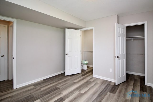 6182 Old Farm Ct, Toledo, OH 43612 - unfurnished bedroom with wood finished floors and a closet