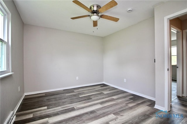 6182 Old Farm Ct, Toledo, OH 43612 - unfurnished room featuring plenty of natural light, dark wood-style floors, a smoke detector, and a ceiling fan