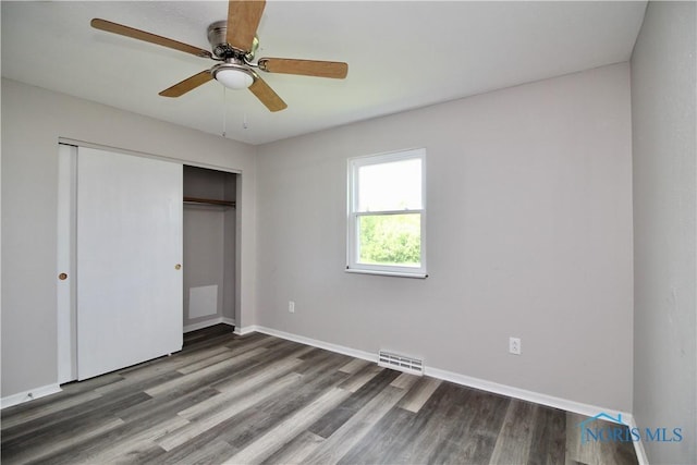 6182 Old Farm Ct, Toledo, OH 43612 - unfurnished bedroom with wood finished floors, a closet, and ceiling fan