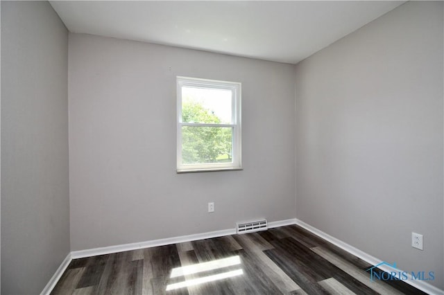 6182 Old Farm Ct, Toledo, OH 43612 - spare room featuring dark wood-type flooring