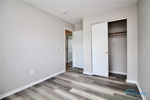 6182 Old Farm Ct, Toledo, OH 43612 - unfurnished bedroom featuring wood finished floors and a closet