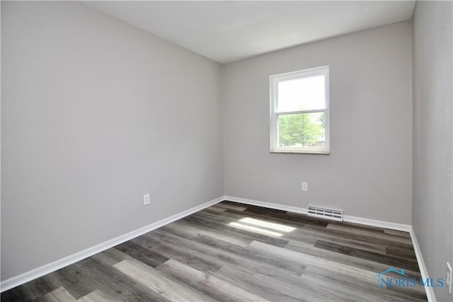 6182 Old Farm Ct, Toledo, OH 43612 - empty room with wood finished floors and baseboards