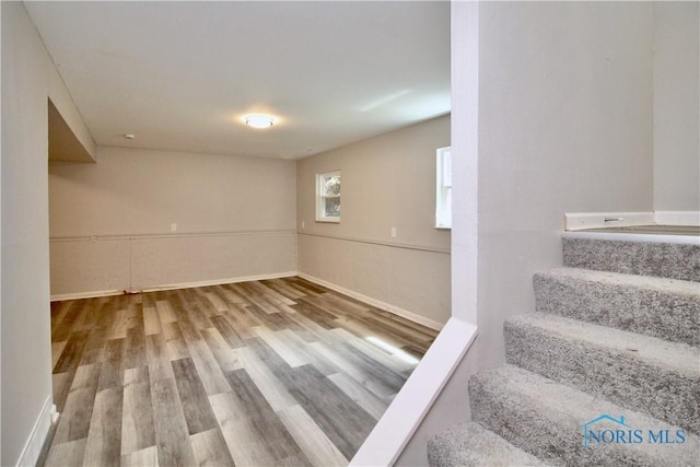 6182 Old Farm Ct, Toledo, OH 43612 - below grade area featuring wood finished floors and stairs