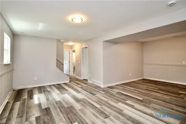 6182 Old Farm Ct, Toledo, OH 43612 - empty room with wood finished floors, a smoke detector, and stairway