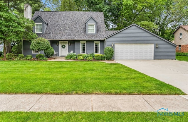 424 Lynshire Ln, Findlay, OH 45840 - cape cod home with roof with shingles, a front lawn, an attached garage, concrete driveway, and a chimney