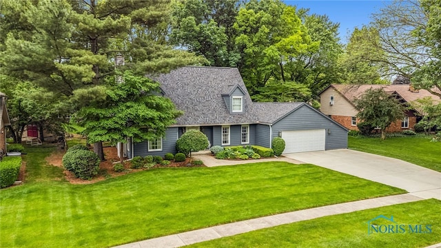 424 Lynshire Ln, Findlay, OH 45840 - cape cod house with concrete driveway, a front yard, a garage, and roof with shingles