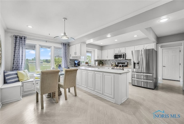 772 Fairway Ln, Wauseon, OH 43567 - kitchen featuring stainless steel appliances, white cabinetry, light countertops, decorative backsplash, and recessed lighting