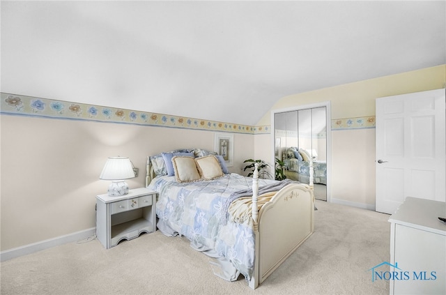 772 Fairway Ln, Wauseon, OH 43567 - bedroom with light colored carpet, lofted ceiling, and a closet