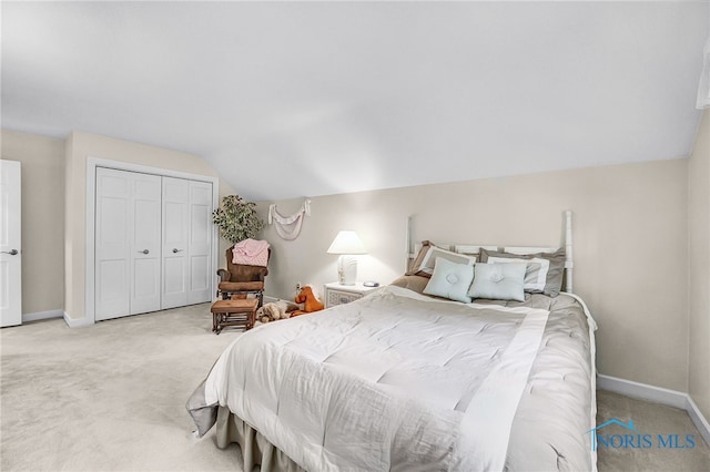 772 Fairway Ln, Wauseon, OH 43567 - bedroom with lofted ceiling, light carpet, and a closet