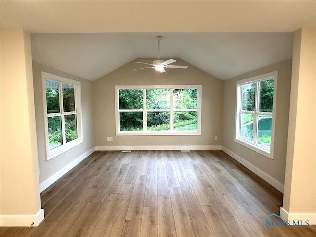 7811 Sonoma Dr, Monclova, OH 43542 - spare room with wood finished floors, ceiling fan, and lofted ceiling
