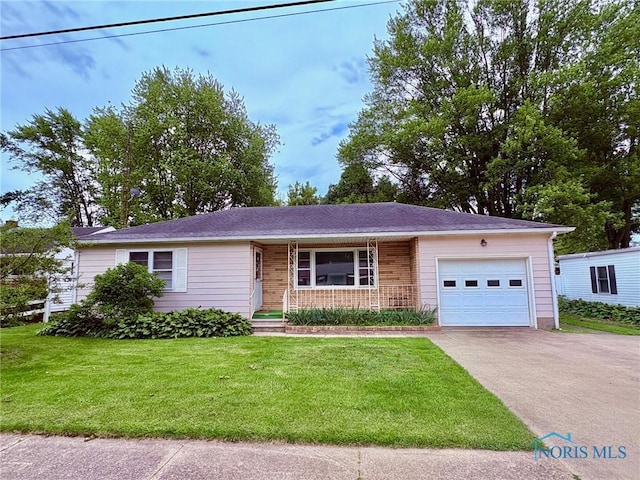 237 Pontious Pl, Napoleon, OH 43545 - single story home with an attached garage, asphalt driveway, covered porch, a front yard, and brick siding