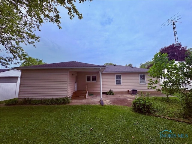 237 Pontious Pl, Napoleon, OH 43545 - rear view of house with a lawn and a patio