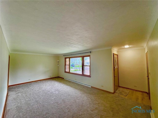 237 Pontious Pl, Napoleon, OH 43545 - spare room with a baseboard radiator, light colored carpet, a textured ceiling, and crown molding