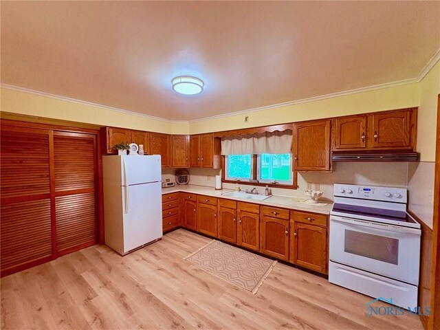237 Pontious Pl, Napoleon, OH 43545 - kitchen featuring white appliances, crown molding, brown cabinets, light countertops, and under cabinet range hood
