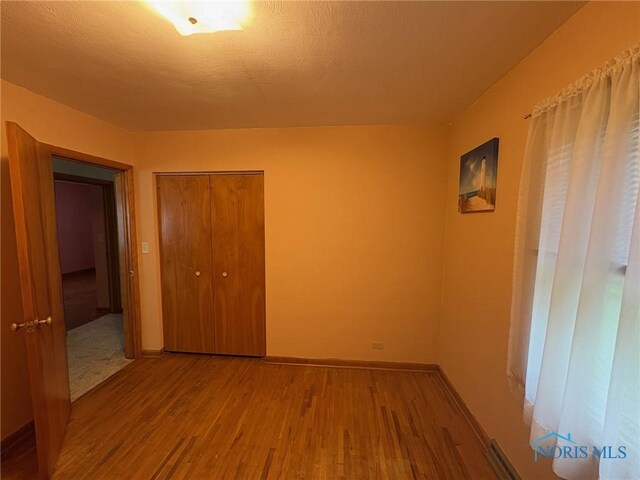 237 Pontious Pl, Napoleon, OH 43545 - spare room with wood finished floors and baseboards