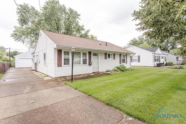 564 Southfield Dr, Maumee, OH 43537 - ranch-style house with a garage, an outdoor structure, a front lawn, and roof with shingles