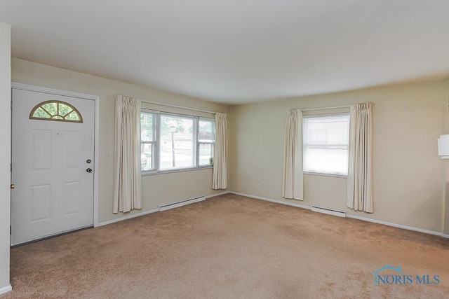 564 Southfield Dr, Maumee, OH 43537 - foyer entrance with a baseboard heating unit and carpet floors