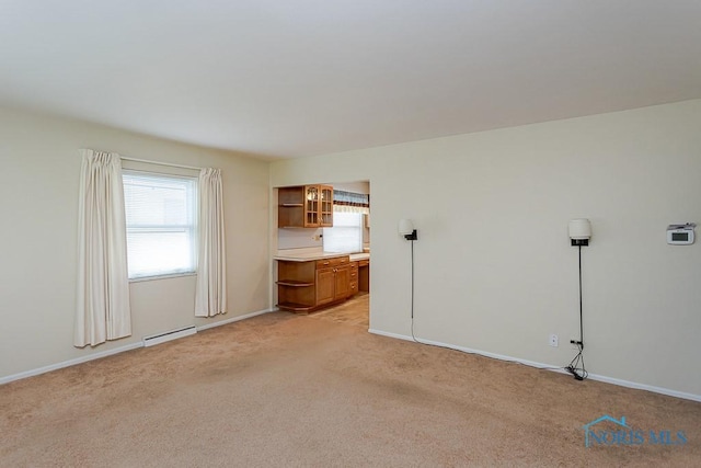 564 Southfield Dr, Maumee, OH 43537 - unfurnished bedroom featuring a baseboard radiator, multiple windows, and light carpet