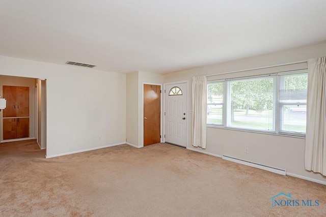 564 Southfield Dr, Maumee, OH 43537 - foyer entrance with baseboard heating and carpet flooring