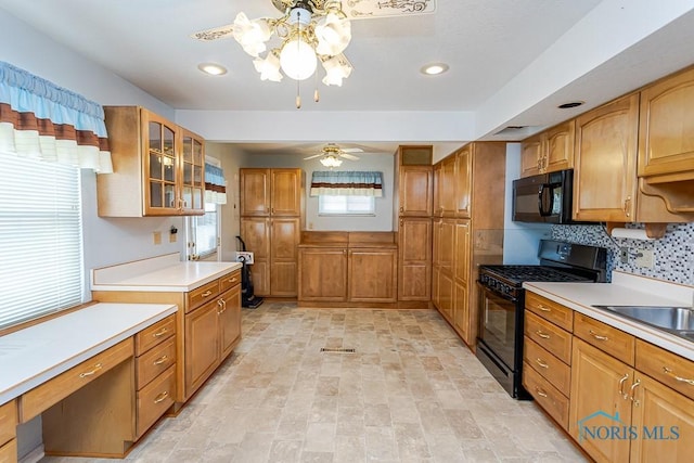 564 Southfield Dr, Maumee, OH 43537 - kitchen with black appliances, glass insert cabinets, light countertops, decorative backsplash, and recessed lighting