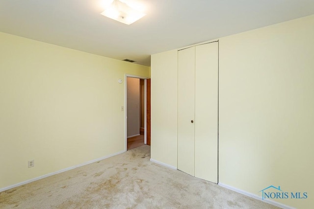 564 Southfield Dr, Maumee, OH 43537 - unfurnished bedroom with light carpet and a closet