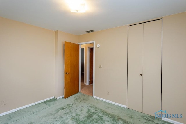 564 Southfield Dr, Maumee, OH 43537 - unfurnished bedroom featuring light colored carpet and a closet