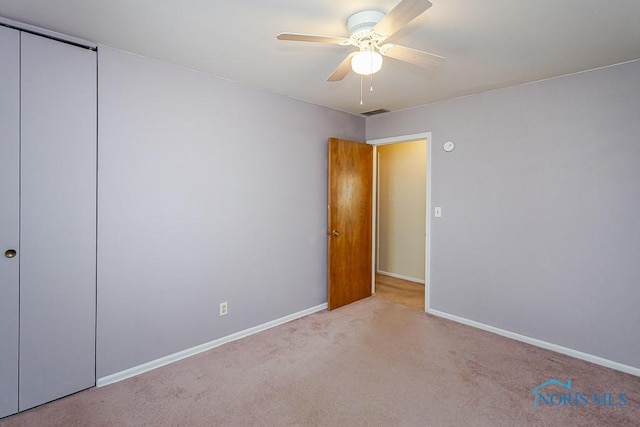 564 Southfield Dr, Maumee, OH 43537 - unfurnished bedroom with carpet, a closet, and ceiling fan