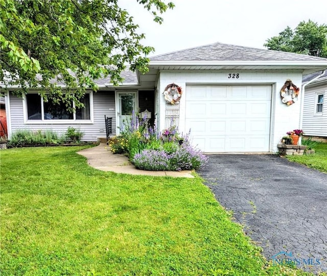 328 W Prentiss Ave, Findlay, OH 45840 - single story home featuring driveway, a front yard, an attached garage, and a shingled roof