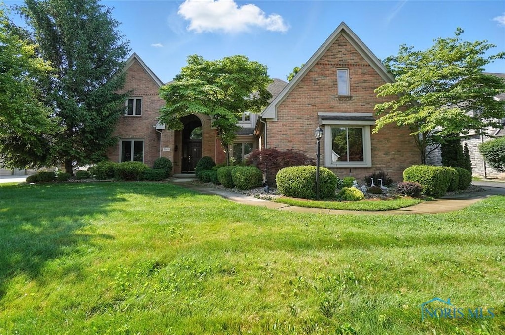 7345 Kings Walk Ln, Sylvania, OH 43560 - view of front of property featuring brick siding and a front yard