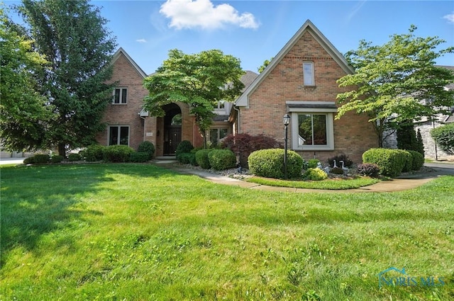 7345 Kings Walk Ln, Sylvania, OH 43560 - view of front of property featuring brick siding and a front yard